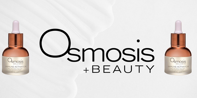 Close-up of Osmosis Rescue Serum bottle on skincare counter.